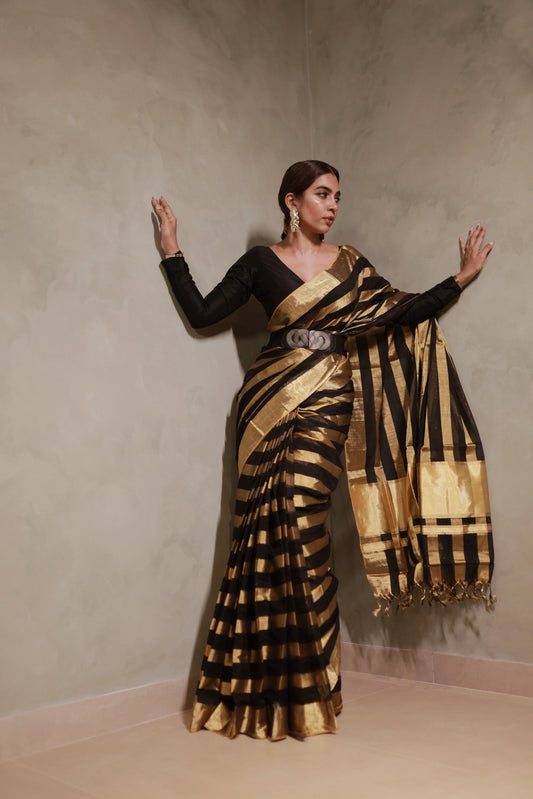 Full-length front view of the black and gold kasavu broad striped handloom saree with matching black blouse
