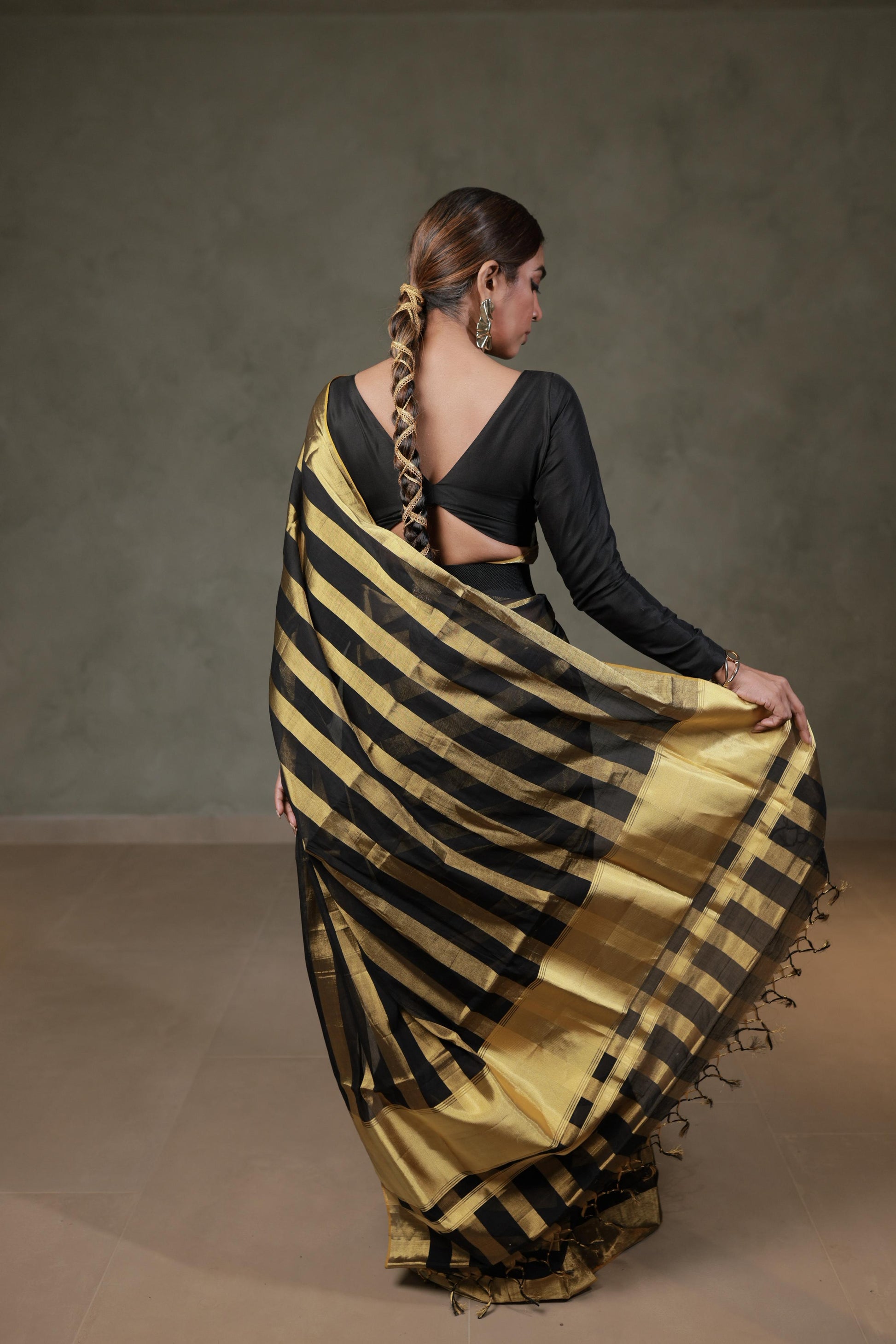Back view showing the gold kasavu pallu with tasselled edge of the Balaramapuram handloom saree